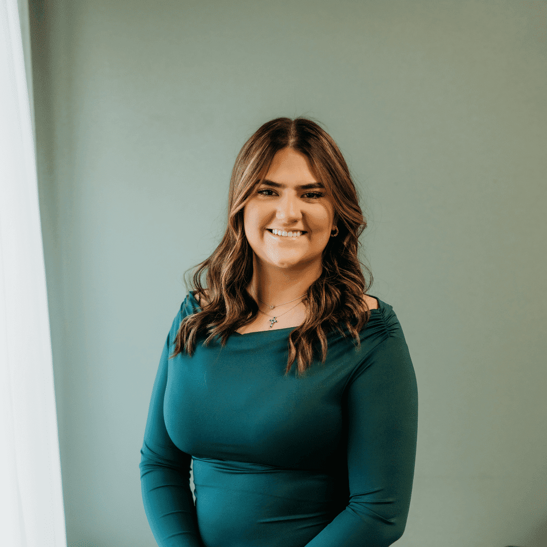 Portrait of Cassandra Immele, a professional stylist at Tangles Salon, showcasing their expertise and style.