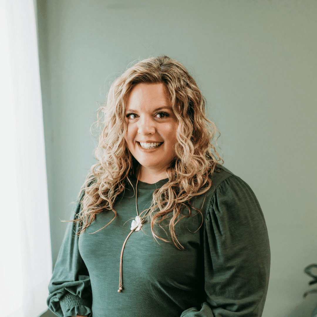 Portrait of Jaime Alley, a professional stylist at Tangles Salon, showcasing their expertise and style.