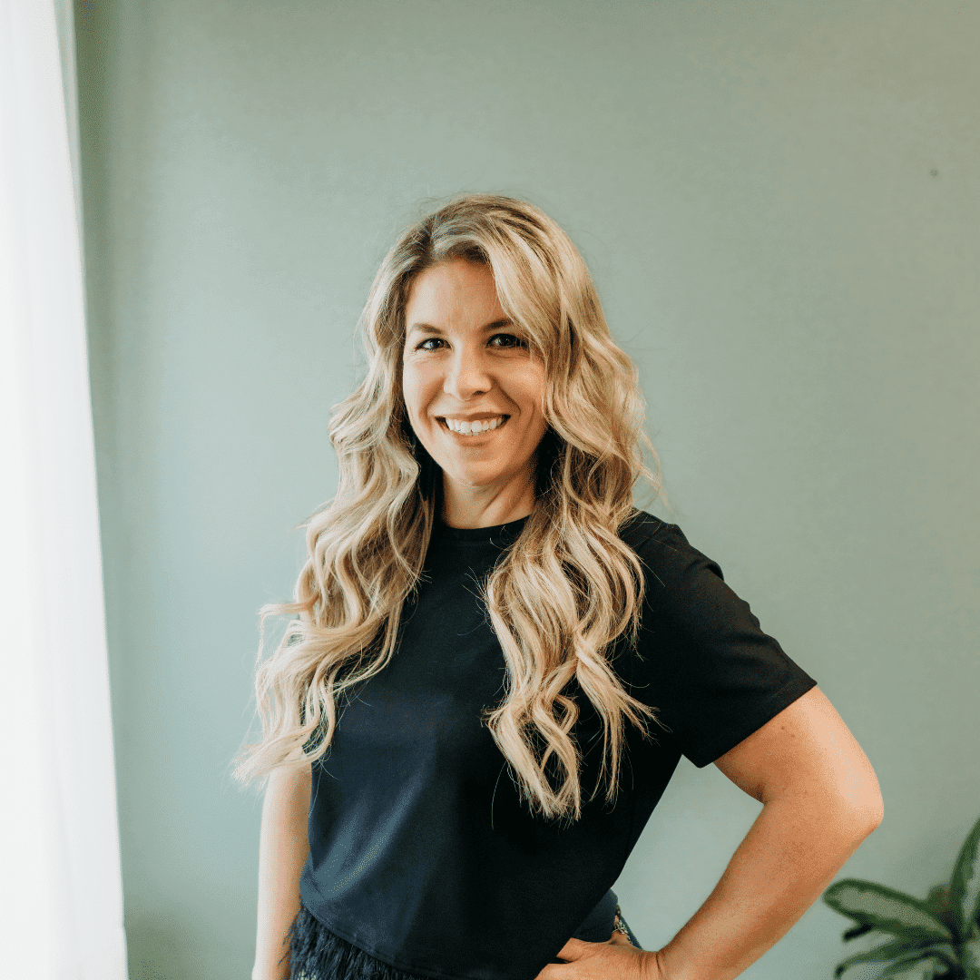 Portrait of Jill Persinger, a professional stylist at Tangles Salon, showcasing their expertise and style.