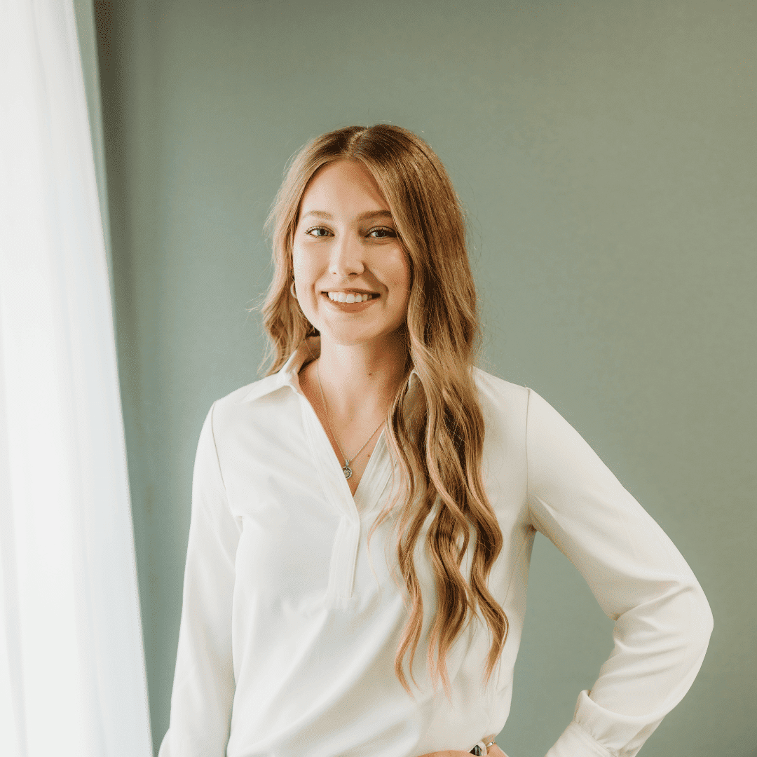 Portrait of Kiersten Cook, a professional stylist at Tangles Salon, showcasing their expertise and style.