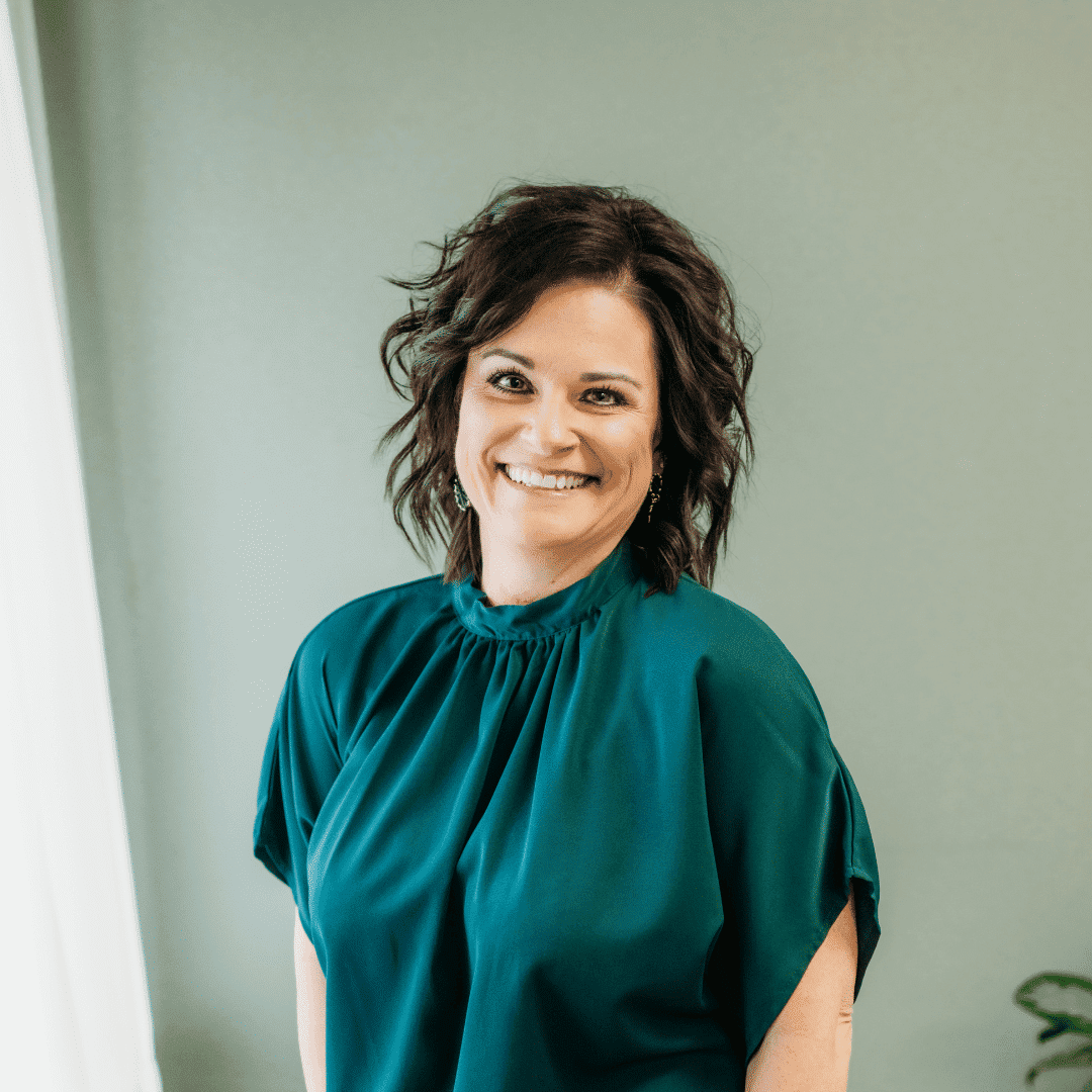 Portrait of Tracy Geary, a professional stylist at Tangles Salon, showcasing their expertise and style.