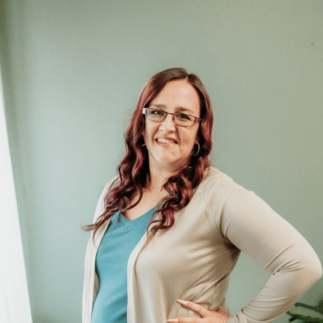 Portrait of Lindsey Carpenter, a professional stylist at Tangles Salon, showcasing their expertise and style.