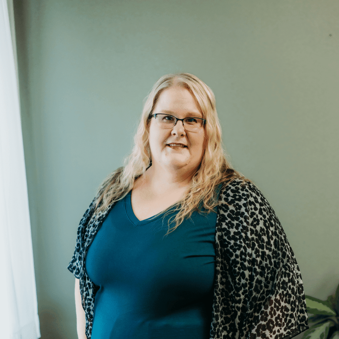 Portrait of Jen Miller, a professional stylist at Tangles Salon, showcasing their expertise and style.